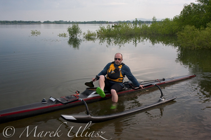 mature paddler in racing outrigger canoe